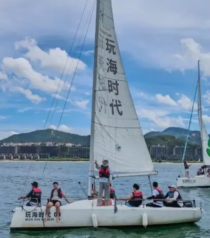 Minew team members taking part in a sailing activity